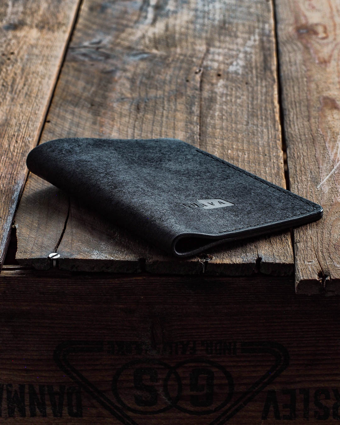 Luava handmade leather passport cover. color black. front in use