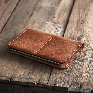 Luava handmade leather passport wallet cognac closed in use angle
