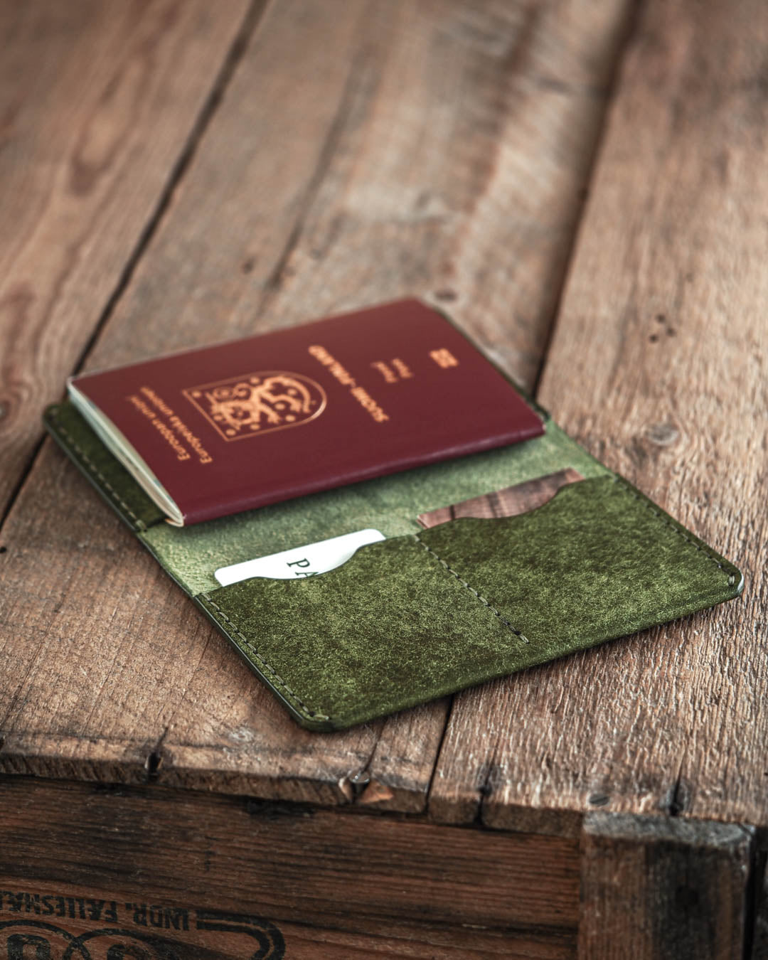Luava handmade leather passport wallet in pine green open in use