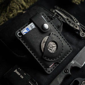 Luava x EDC.CULT edc wallet in black in use close up. handmade with full-grain vegetable-tanned leather. Everyday carry wallet with airtag pocket