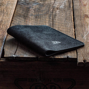 Luava handmade leather passport cover. color black. front in use
