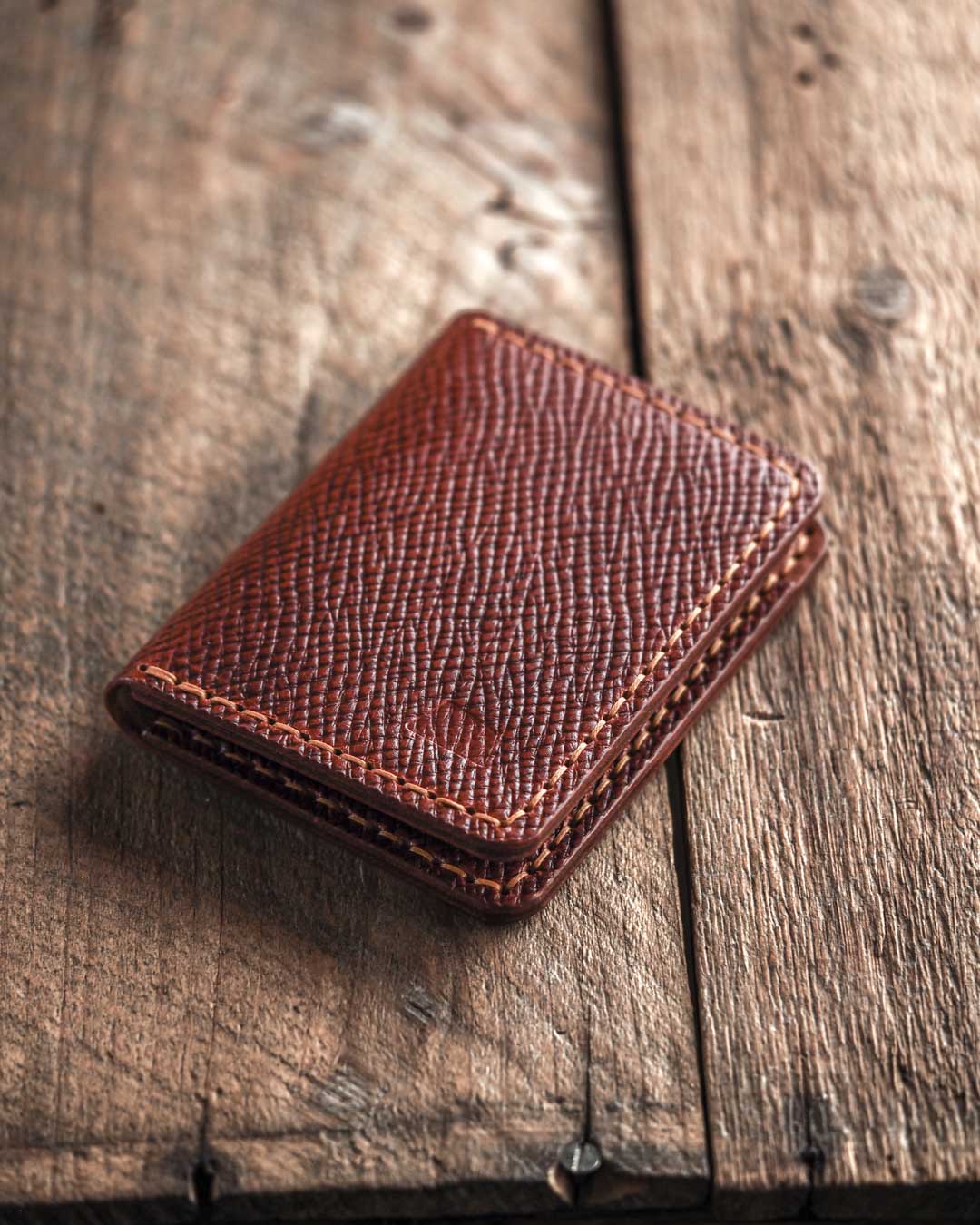 Brown Swarm wallet a bifold leather wallet closed