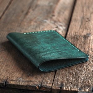 Luava handmade leather passport sleeve cover. color aqua. back