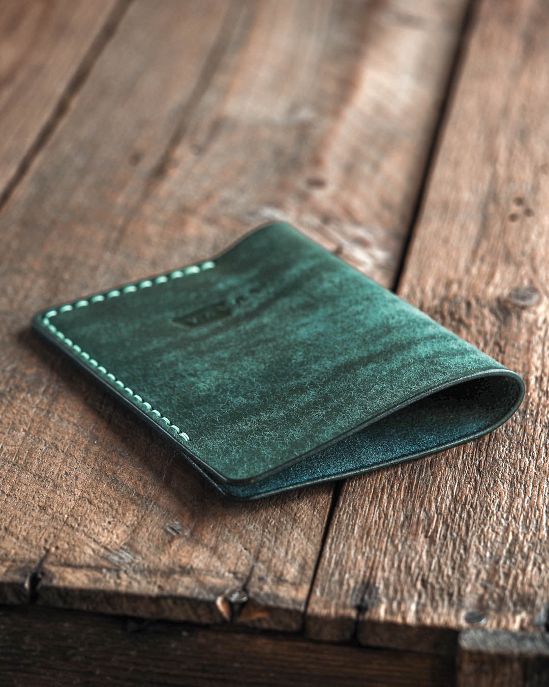 Luava handmade leather passport sleeve cover. color aqua. angle