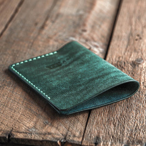 Luava handmade leather passport sleeve cover. color aqua. angle