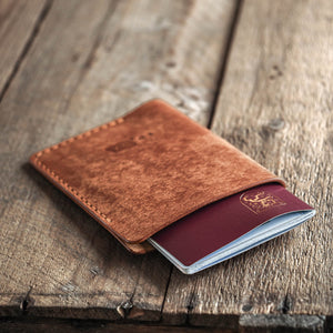 Luava handmade leather passport cover. color cognac. front in use