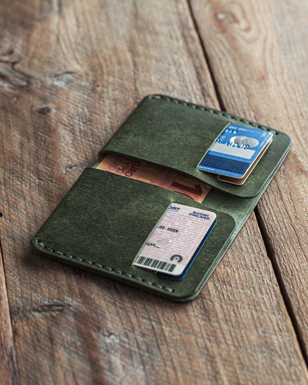 Luava handmade leather bi-fold wallet for men pine green open in use