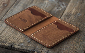 Handmade leather wallet. Handcrafted with high quality full-grain vegetable tanned leather and saddle stitched with strong wax thread.