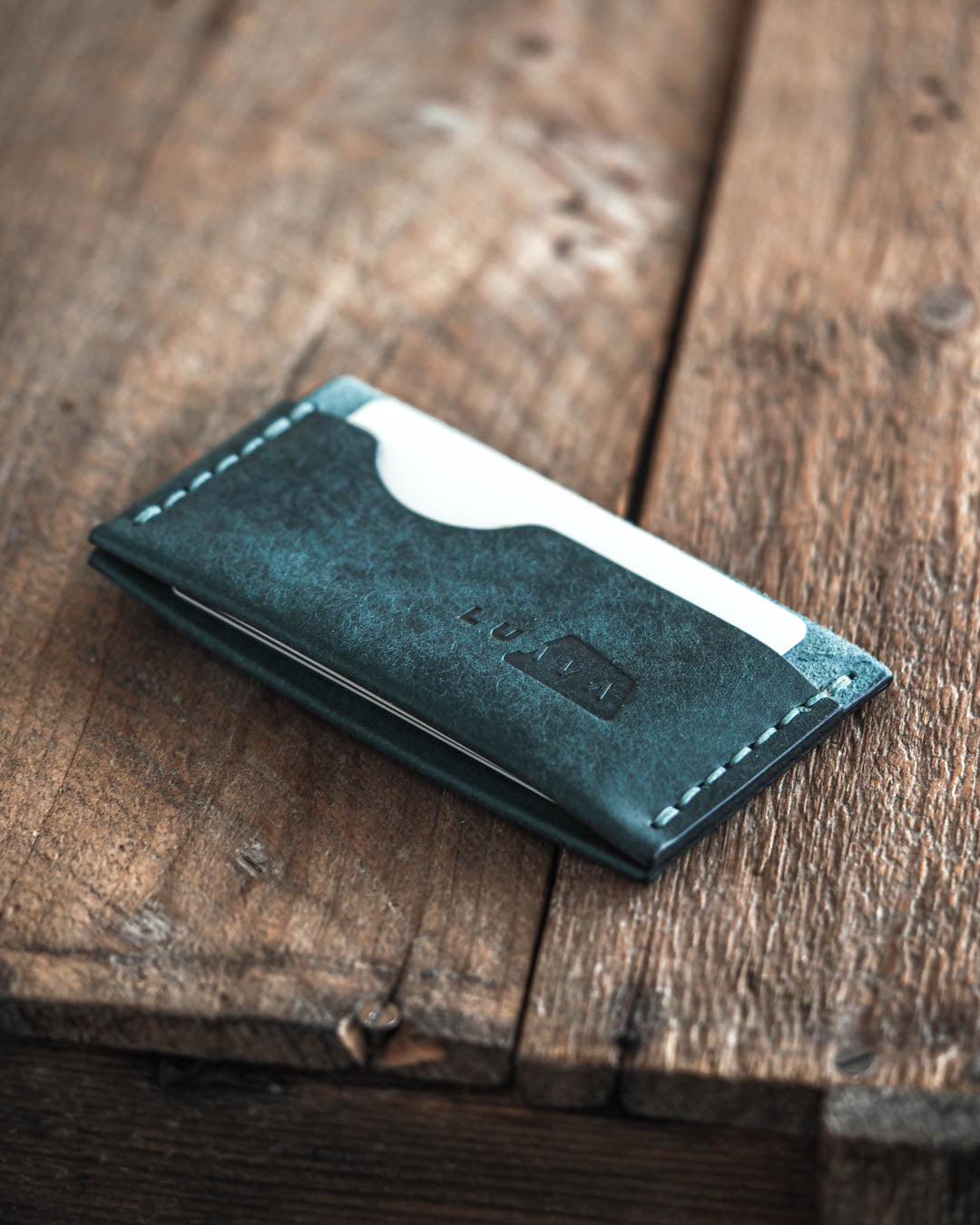 Luava handmade leather wallet Flat in aqua color back in use