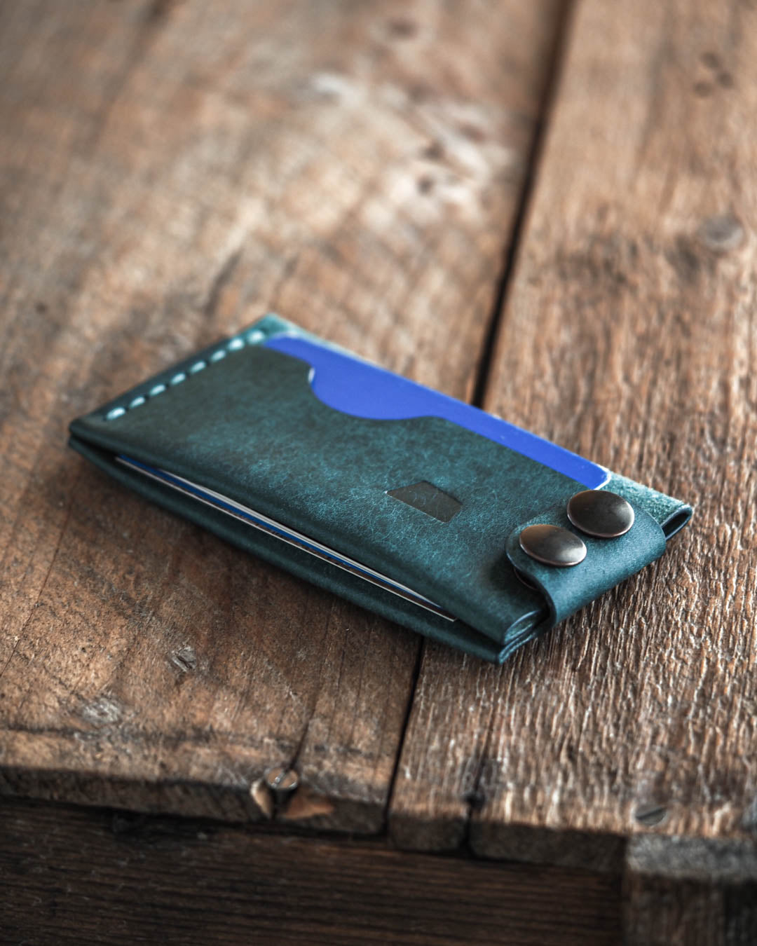Luava handmade leather wallet Flat in aqua color front in use