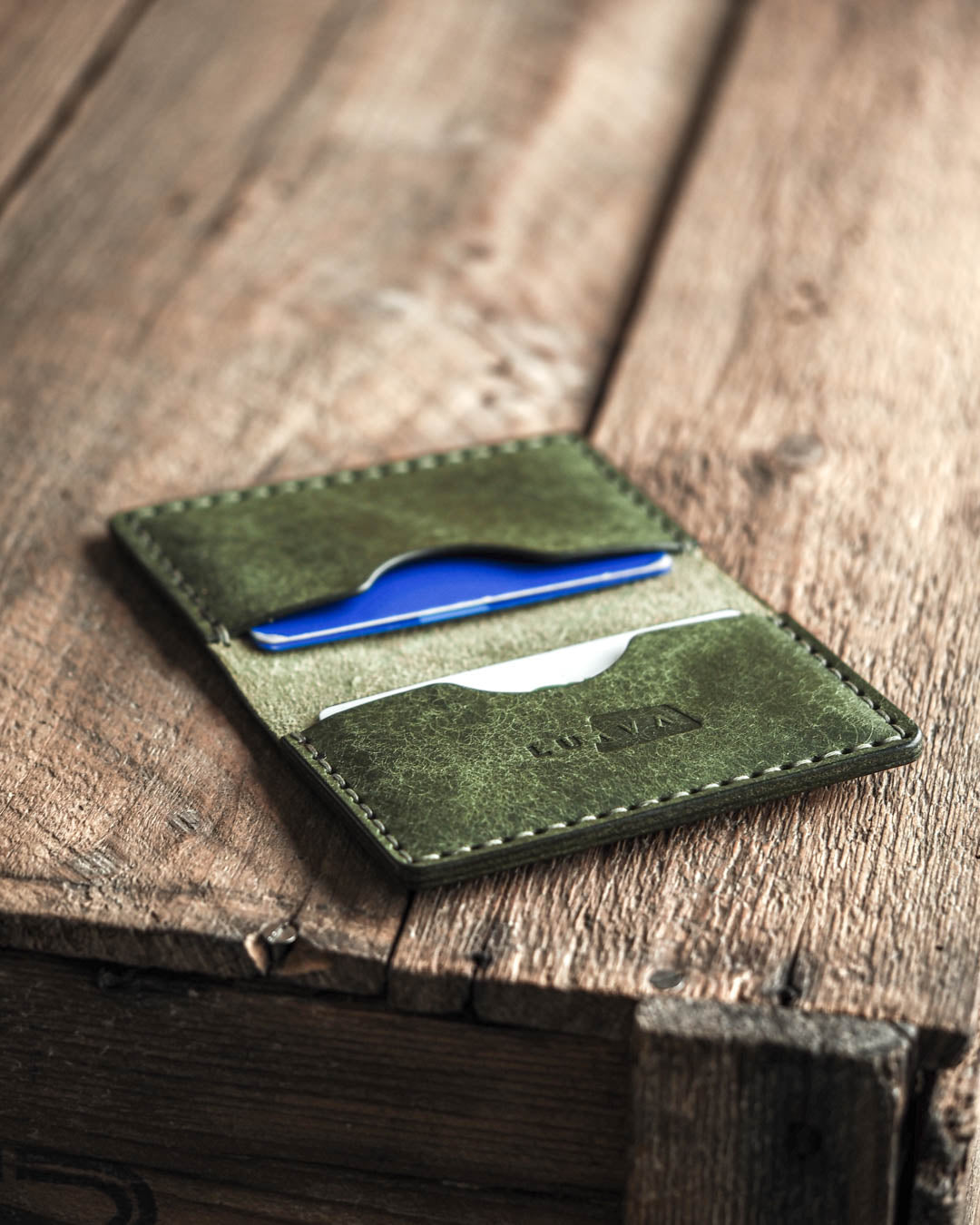 Luava handmade leather bi-fold wallet journeyman pine open in use