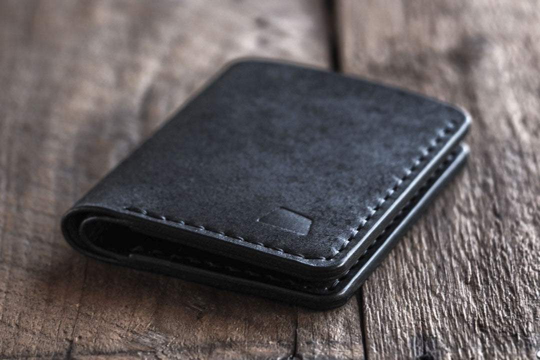 Handmade leather bi-fold wallet for men in color black