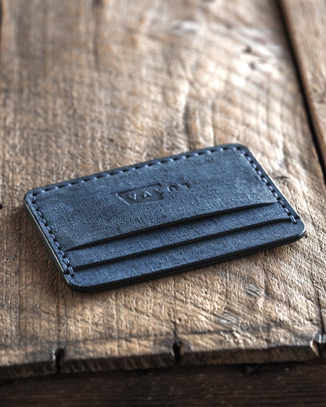 Handmade fabric like vegetable tanned full grain leather wallet made with blue leather. Proper wallet front angle
