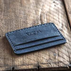 Handmade fabric like vegetable tanned full grain leather wallet made with blue leather. Proper wallet front angle