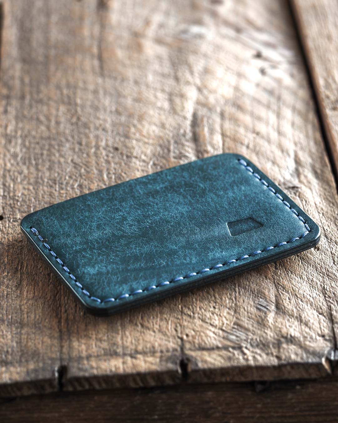 Handmade fabric like vegetable tanned full grain leather wallet made with blue leather. Proper wallet back