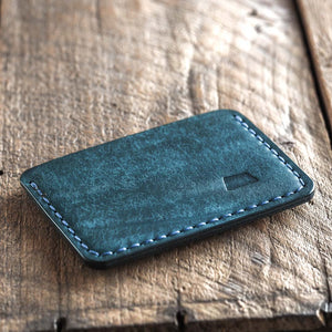 Handmade fabric like vegetable tanned full grain leather wallet made with blue leather. Proper wallet back
