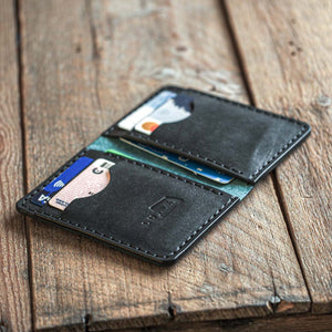 Luava handmade leather bi-fold wallet for men ranch open in use. Mens wallet.