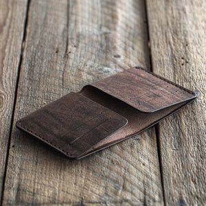 Handmade leather bi-fold wallet for men. Minimalist and rugged style. Traveler's wallet tabacco dark brown open