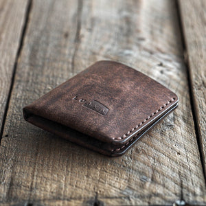 Handmade leather bi-fold wallet for men. Minimalist and rugged style. Traveler's wallet tabacco dark brown front