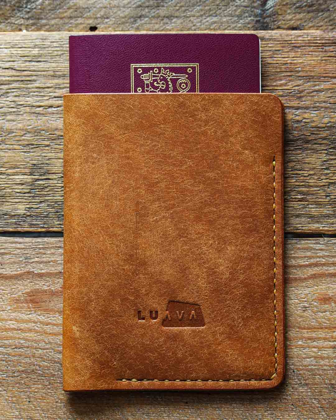 Luava handcrafted leather passport cover pueblo cognac in use